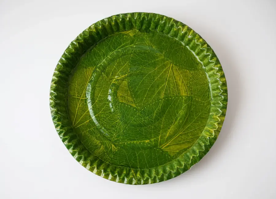 Leaf print paper dish in green patravali style for functions and bhandara
